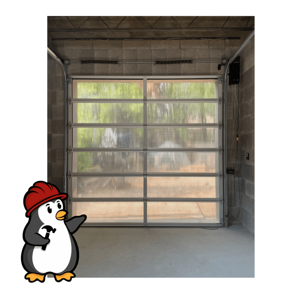 Penguin Garage Doors logo showcasing professional garage door replacement and installation services with expert technicians.